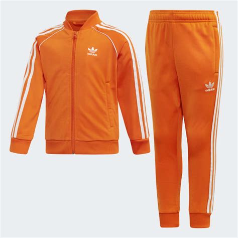 adidas jogginganzug herren orange|Adidas 3 bar joggers.